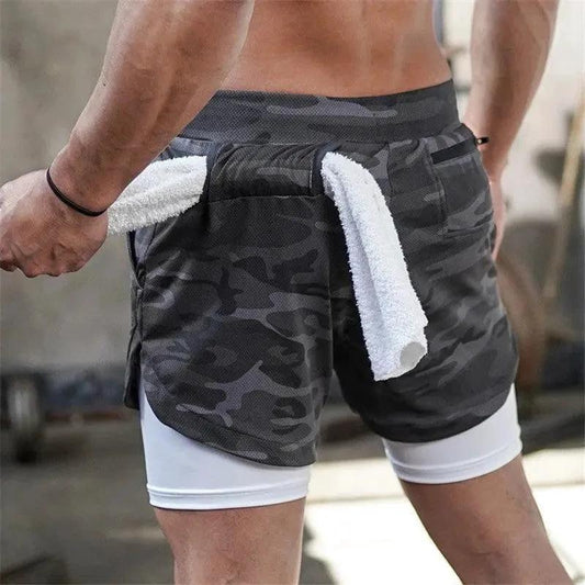Mandotos pocket compression shorts in black with built-in pockets, designed for athletic performance and support.