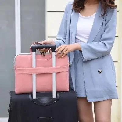 Mandotos PU leather women's laptop bag with shoulder strap, fits MacBook Air 13.3 to 15.6 inches, carries notebooks and accessories.