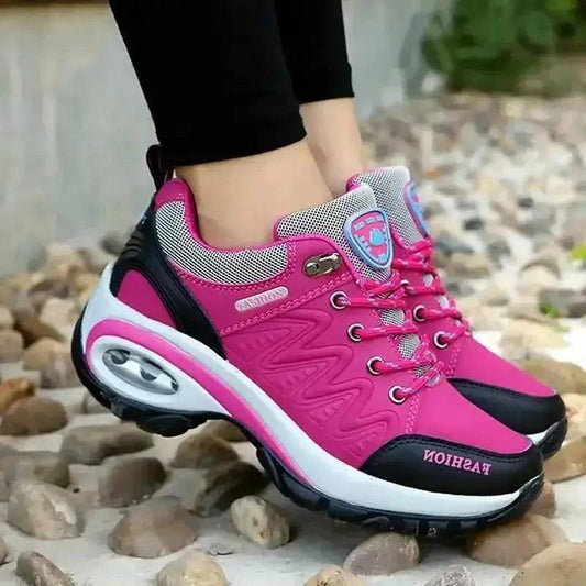 Mandotos running shoes in black and white with cushioned soles and breathable mesh upper for comfortable exercise.