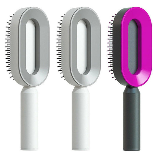 Mandotos self-cleaning hair brush with scalp massage features, showing the brush's bristles and ergonomic handle.