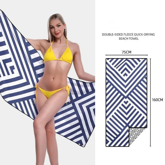 Mandotos SwiftDry patterned beach towel with colorful geometric design laid out on sandy beach