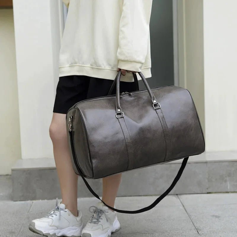 Mandotos men's travel bag in PU leather with large capacity, shoulder strap, and stylish tote design for men and women.