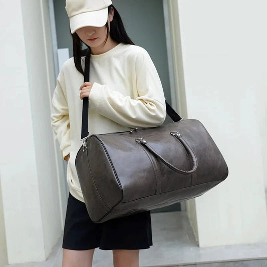Mandotos men's travel bag made of PU leather with a large capacity, shoulder strap, and stylish design for women and men.