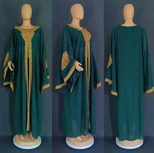 Gold two-piece kaftan abaya dress set by MANDOTOS, featuring flowing fabric and elegant design, suitable for special occasions.