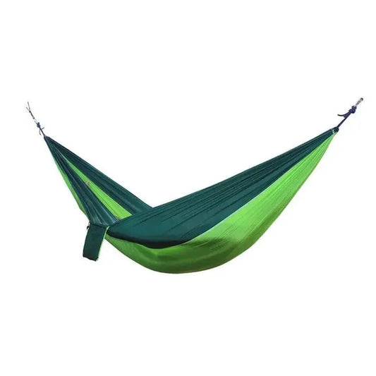 Mandotos Ultimate Oasis single double hammock with sturdy fabric and wooden spreader bars, perfect for relaxing outdoors.