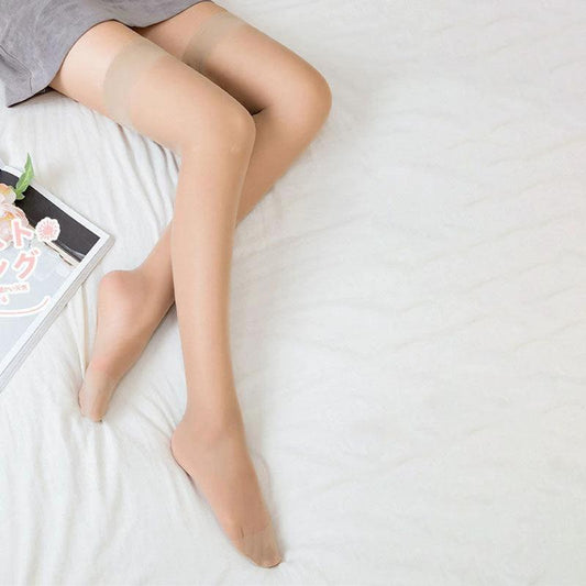 Women's sheer thigh-high socks from MANDOTOS, lightweight summer hosiery with a delicate, transparent design for warm weather.