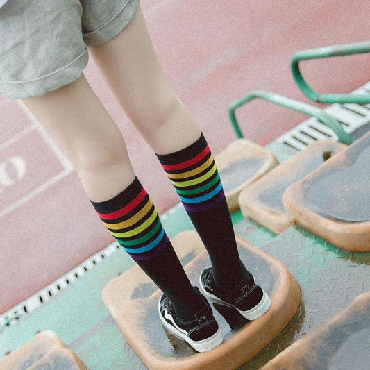Women's striped knee-high cotton socks by MANDOTOS, featuring colorful horizontal stripes and a soft, comfortable fit.