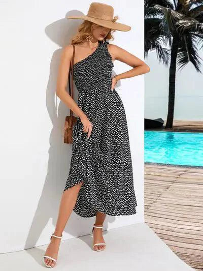 Mandotos Zoe asymmetrical midi dress featuring flowing fabric, stylish design, and a modern silhouette for elegant occasions.