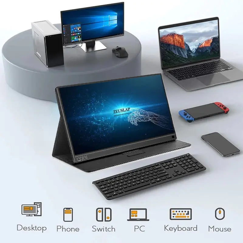 ZEUS 16'' 2.5K Ultra-Smooth Portable Gaming Monitor on a desk with keyboard, laptop, Switch, and smartphone.