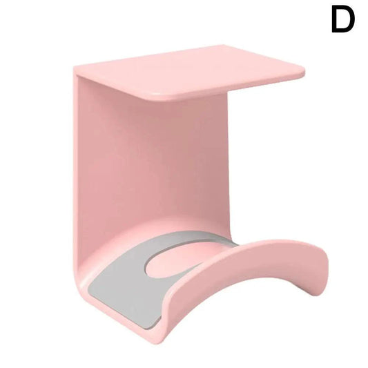 Universal headphone stand and wall mount hanger for gaming earphones, made of plastic with adhesive support for under-desk use.