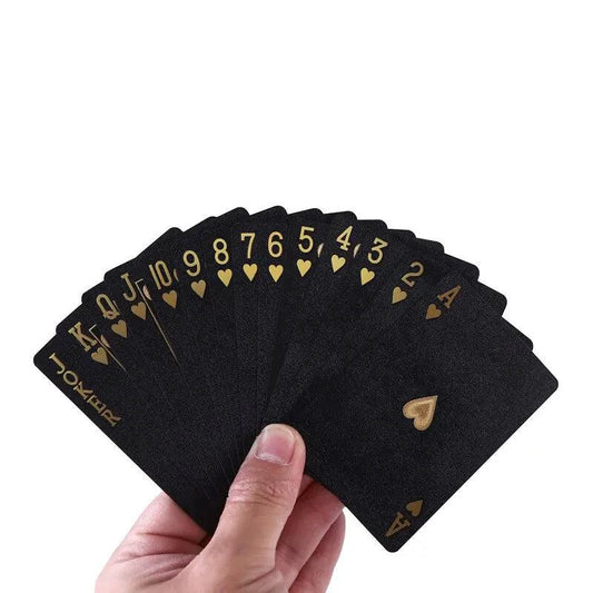 Black and gold waterproof poker playing cards from Dmagic, featuring a suit and magic-themed design for card games and collection.