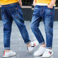 Kids wearing stylish blue jeans with rolled cuffs and white sneakers, perfect for casual fashion