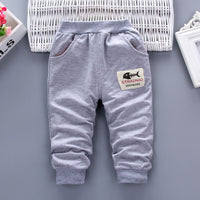 Gray kids joggers with fishbone patch, cozy elastic cuffs, perfect for casual wear