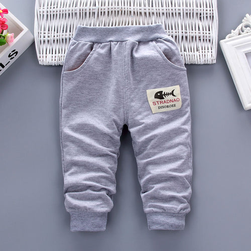 Gray kids joggers with fishbone patch, cozy elastic cuffs, perfect for casual wear