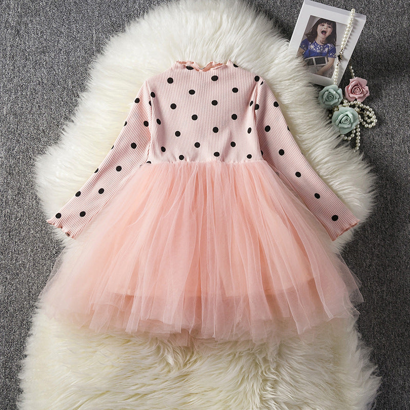 Pink polka dot tulle dress for girls, long sleeve party outfit on fluffy white rug