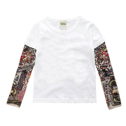 White long-sleeve kids tee with colorful tattoo-style sleeve prints, featuring skulls and flames design