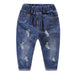 Kids' distressed denim jeans with ripped details, elastic waist, and cuffed hems for casual fashion wear