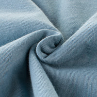 Soft blue knit fabric texture, ideal for premium fashion apparel and cozy wear