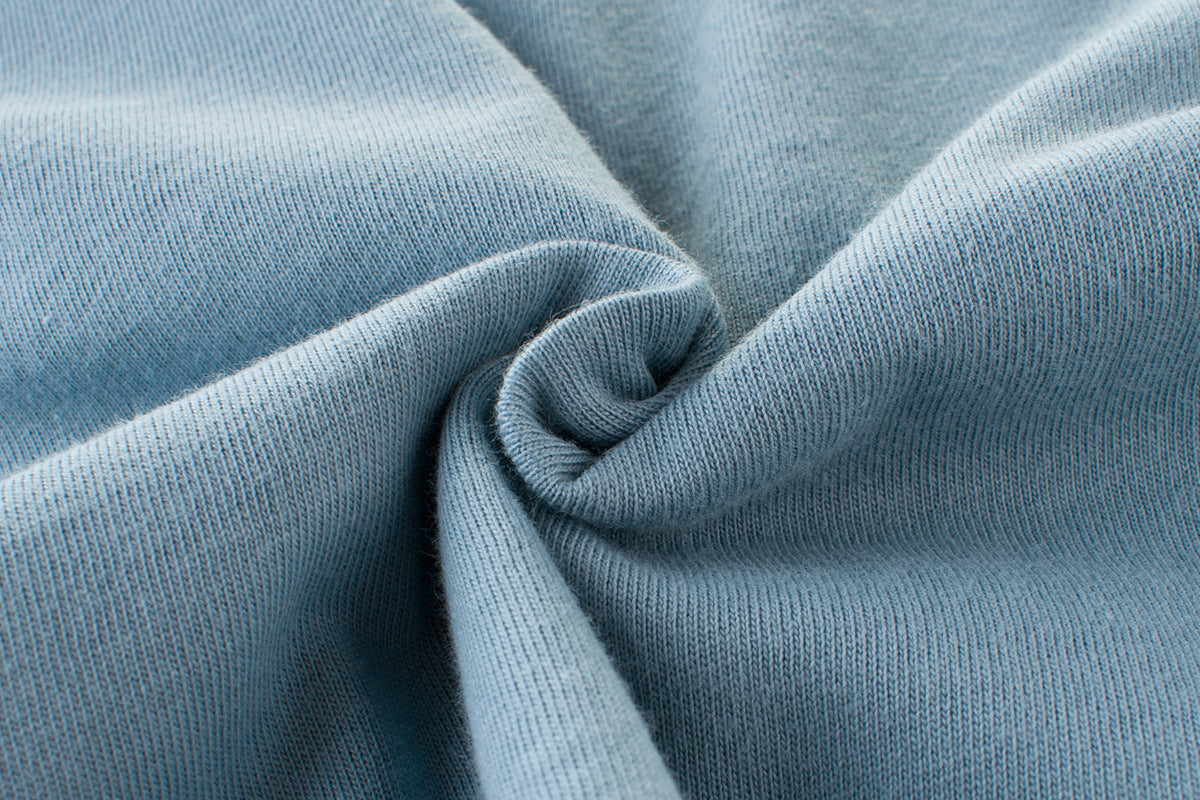 Soft blue knit fabric texture, ideal for premium fashion apparel and cozy wear