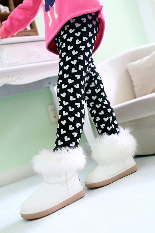 White fuzzy winter boots with black heart print leggings for kids