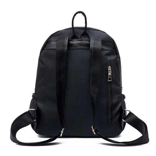 Black nylon backpack with adjustable straps and side zipper pocket, ideal for daily use or travel
