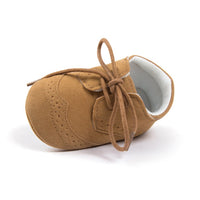 Tan suede baby shoes with laces, soft sole, perfect for newborns and infants