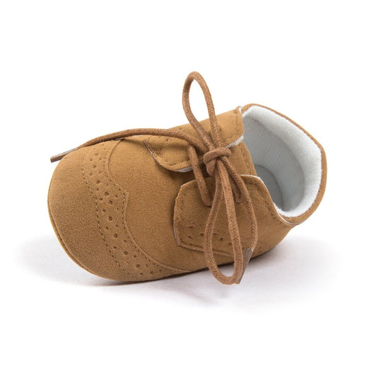 Tan suede baby shoes with laces, soft sole, perfect for newborns and infants