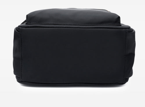 Black structured tote bag with clean lines and durable stitching, ideal for everyday fashion use
