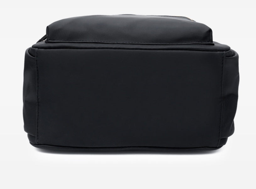 Black structured tote bag with clean lines and durable stitching, ideal for everyday fashion use