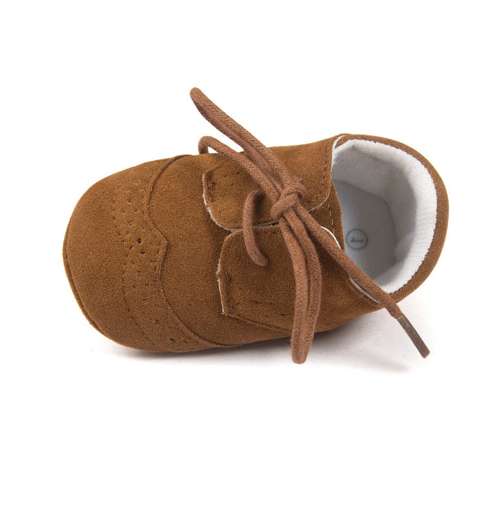 Brown suede baby shoes with laces, soft sole, white interior, perfect for infants and toddlers