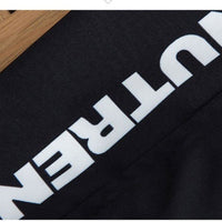 Black fabric with bold white NUTREN text, styled for fashion apparel