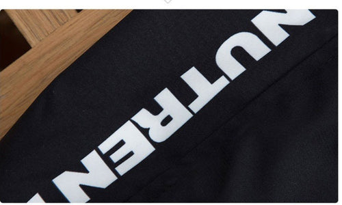 Black fabric with bold white NUTREN text, styled for fashion apparel