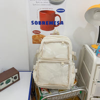 Cream transparent panel backpack on metal cart, retro radio and poster backdrop