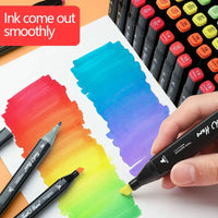 Smooth ink dual-tip markers creating vibrant rainbow swatches for art and design