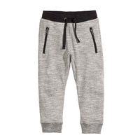 Gray heather jogger pants with black drawstring waist and side zip pockets, casual kids fashion
