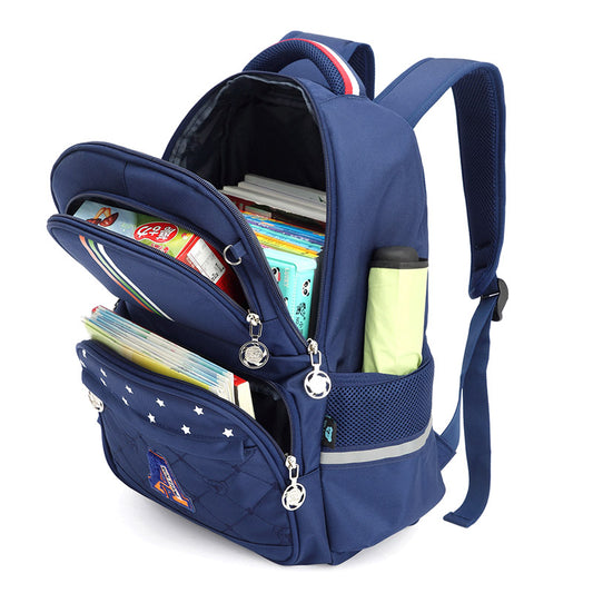 Blue kids school backpack with star pattern, multiple compartments holding books, snacks, and water bottle