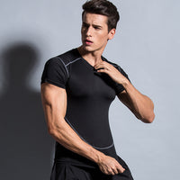 Men's black compression shirt with gray seams, fitness apparel for gym workouts and athletic training