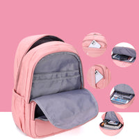 Pink backpack with gray interior, showcasing organized compartments for electronics and books