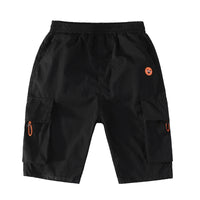 Black cargo shorts with orange alien patch and side pockets, stylish streetwear for men