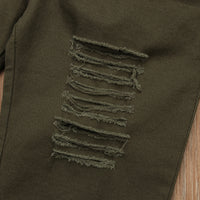 Olive green ripped jeans with distressed detailing for casual fashion