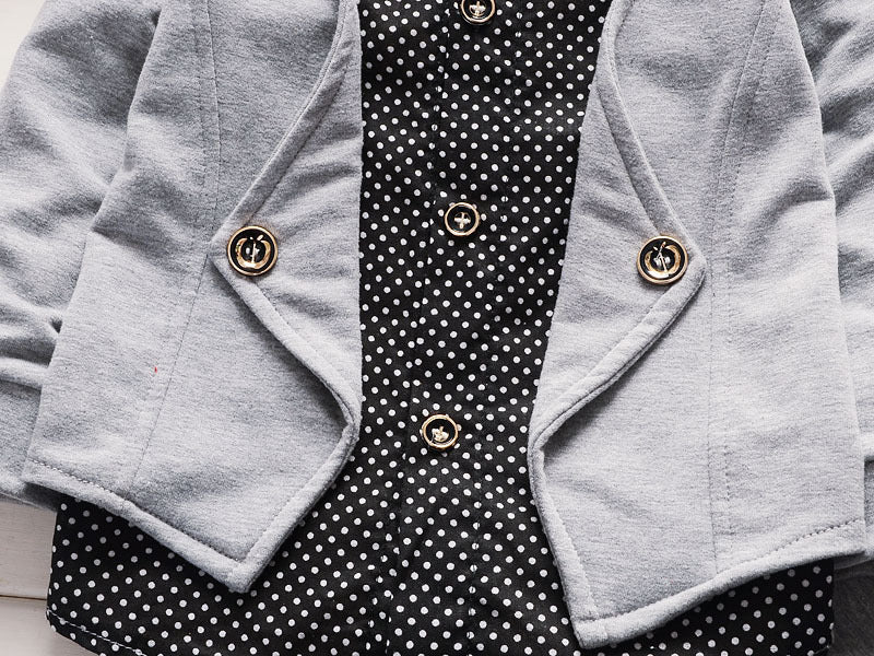 Gray cardigan with gold buttons over black polka dot blouse, stylish women's fashion outfit