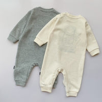 Soft baby rompers in gray and cream, cozy long-sleeve one-piece outfits for infants