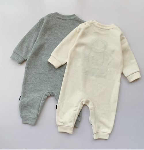Soft baby rompers in gray and cream, cozy long-sleeve one-piece outfits for infants