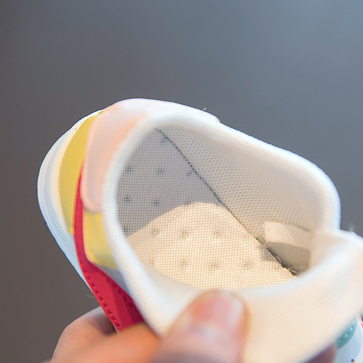 Baby sneaker with breathable mesh interior and colorful accents, soft sole for first walkers