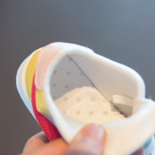 Baby sneaker with breathable mesh interior and colorful accents, soft sole for first walkers
