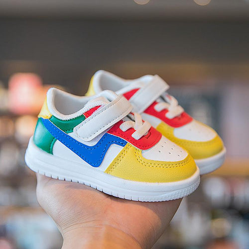 Colorful toddler sneakers with velcro straps, vibrant rainbow design, soft sole, perfect for little feet