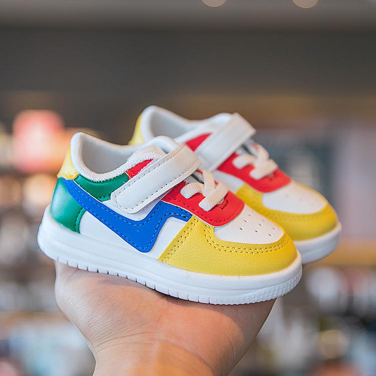 Colorful toddler sneakers with velcro straps, vibrant rainbow design, soft sole, perfect for little feet