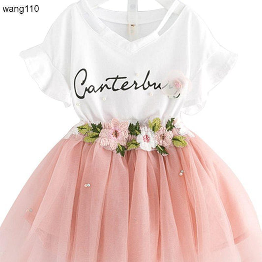 Girls' white V-neck dress with pink tulle skirt, floral embroidery, and 'Canterbury' script
