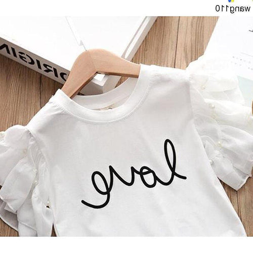White kids' t-shirt with 'love' script print, ruffled sleeves, on wooden hanger — fashion apparel