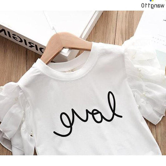 White kids' t-shirt with 'love' script print, ruffled sleeves, on wooden hanger — fashion apparel